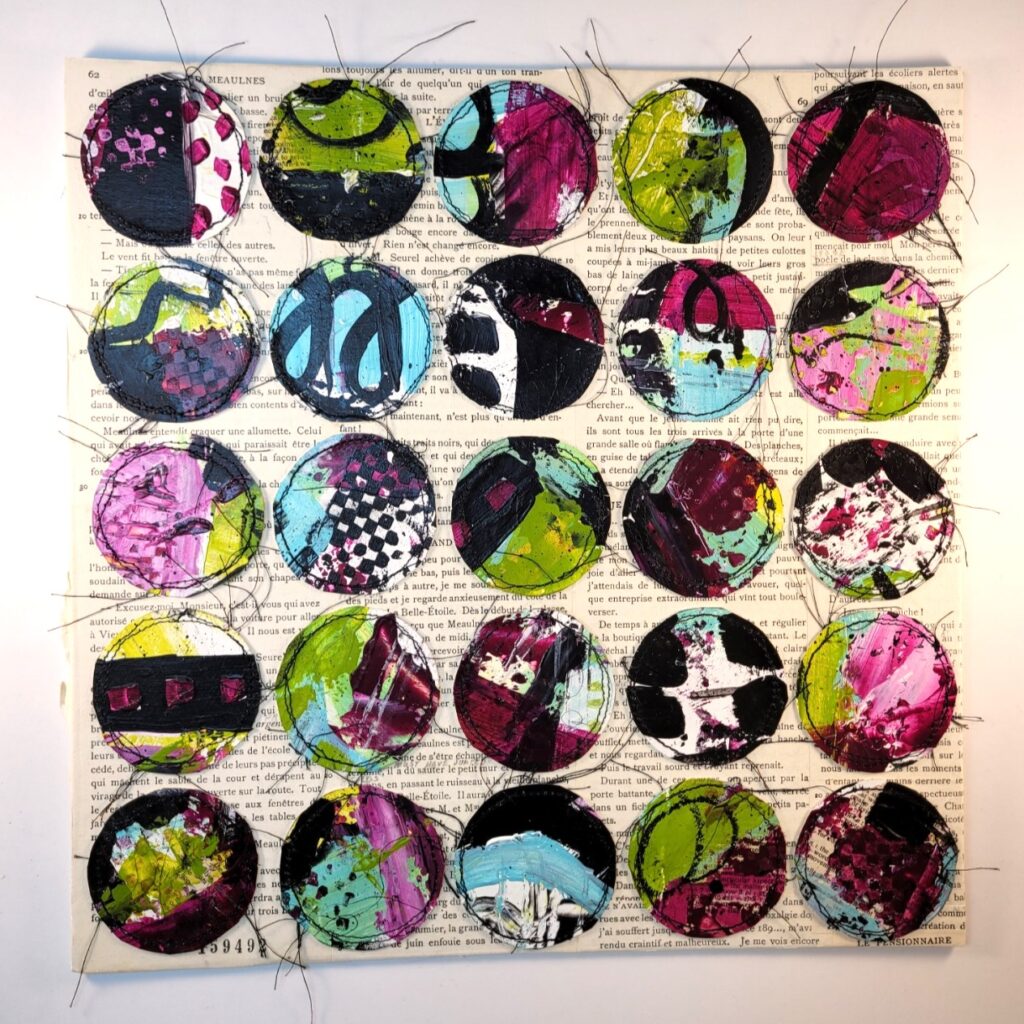 A quilt with circles of fabric on it